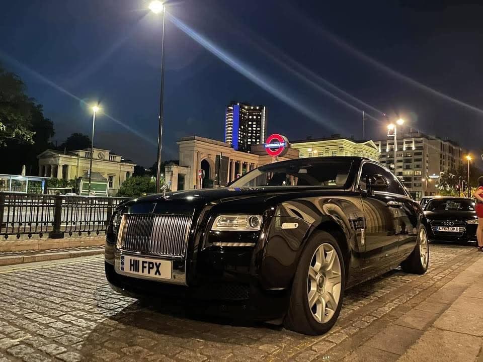 Luxury , executive sedan and Rolls-Royce Ghost chauffeur vehicles outside The Langham Hotel in London.
